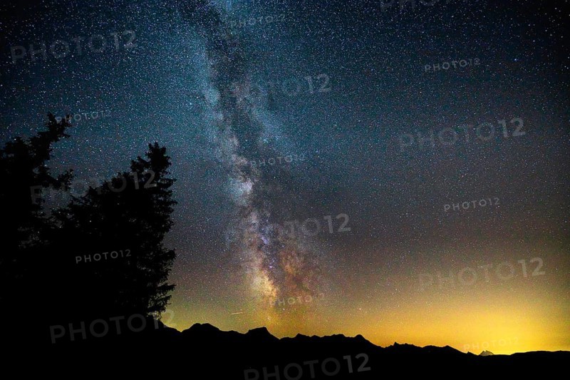 Starry Milky Way above a mountain panorama at dusk, Gantrisch Star Park, Bernese Oberland, Canton of Bern, Switzerland, Europe