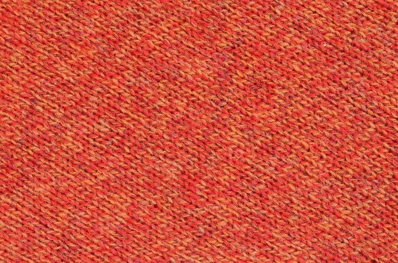 Abstract Background Texture Of Knitted Orange Wool Fabric