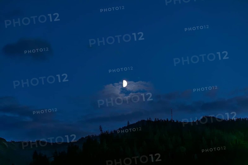Moon over a range of hills, Mugel mountain, Leoben, Styria, Austria, Europe