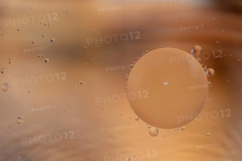 Colorful abstract macro background with oil drops in water