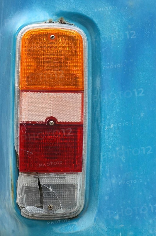Detail of a Brake Light on a Weathered Vintage Camper Van