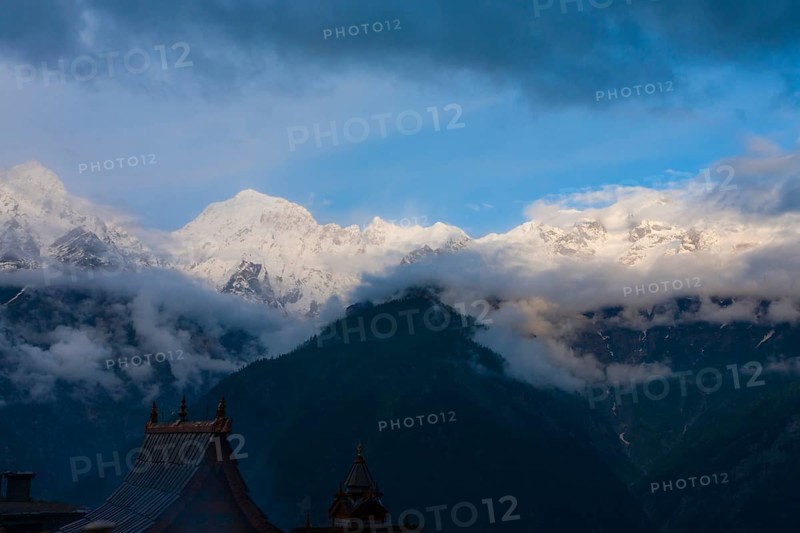 The beautiful snow capped peaks of the pilgrimage destination, the Kinnaur Kailash mountain range seen from the temple complex at Kalpa, Himachal Pradesh, India, Asia