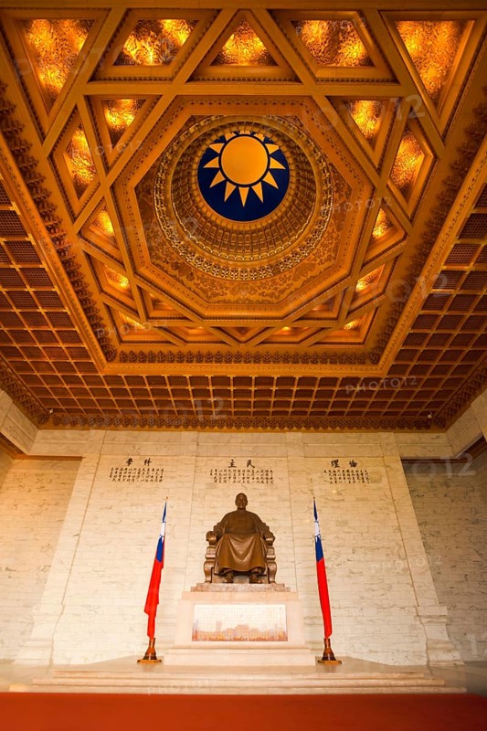 A beautifully ornate ceiling and a statue of Chiang Kai Shek inside the cavernous Memorial Hall in Taipei, Taiwan, Asia