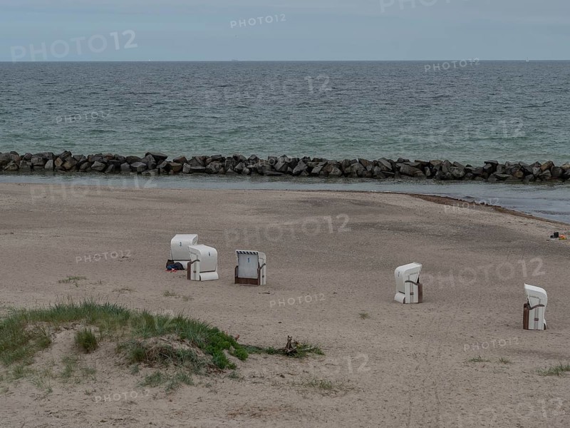 An empty beach with a few beach chairs, a calm sea and stone breakwaters in the background. A quiet and peaceful atmosphere, ahrenshoop, zingst, Baltic Sea, Germany, Europe