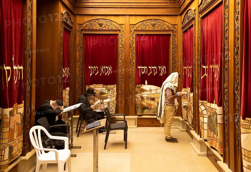 Jerusalem, Israel, 15 April, 2022: Orthodox jews is praying in synagogue near Sacred Western Wailing Wall in Jerusalem Old City, Asia