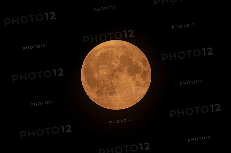 Blue full supermoon above Belgium glows red because of North American wildfire smoke in the atmosphere on August 19 2024