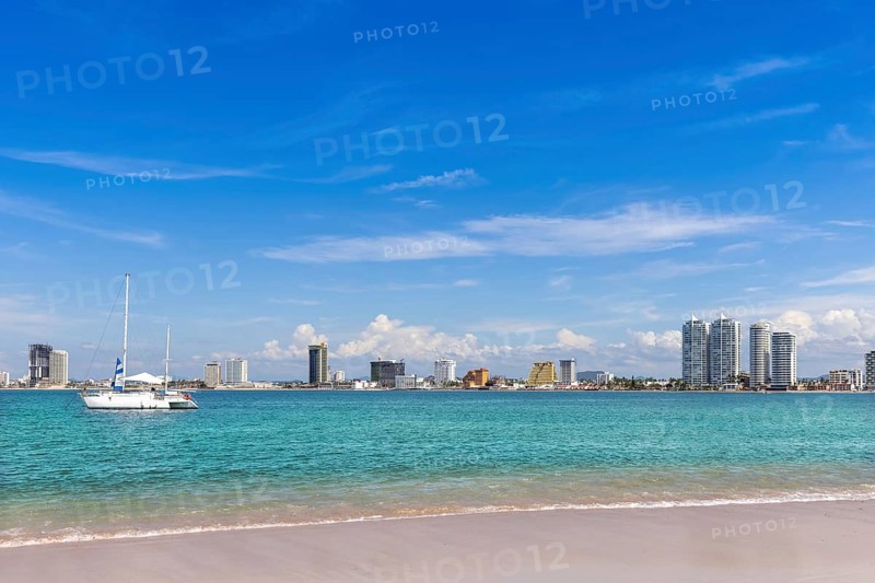View from Deer Island, Isla de Venados, of famous Mazatlan sea promenade El Malecon, with ocean lookouts luxury hotels, beaches and scenic landscapes