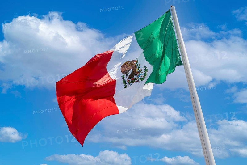 Los Cabos San Jose Del Cabo, Mexico, Mexican tricolor national striped flag proudly waving at mast, Central America