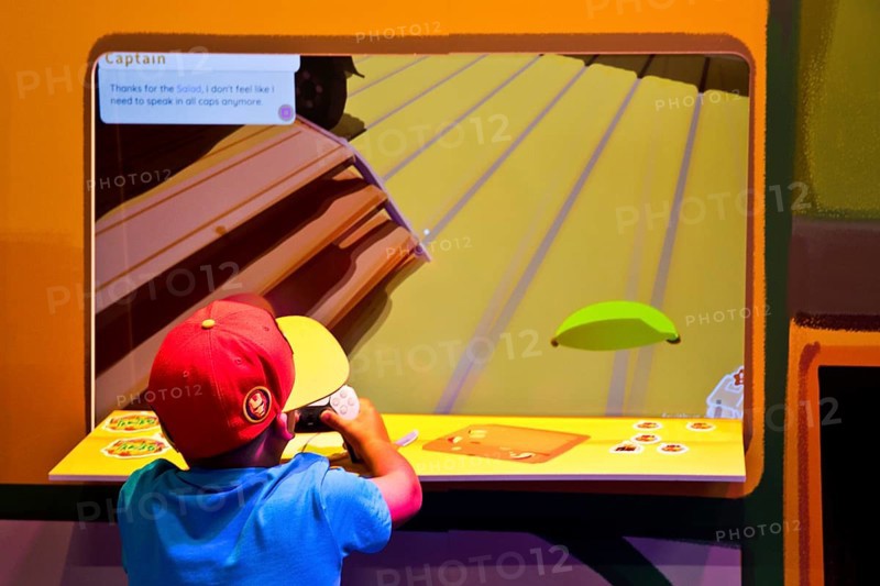 Child in front of a screen with a computer game, Gamescom trade fair, the world's largest trade fair for computer games and consumer electronics, Cologne, Germany, Europe