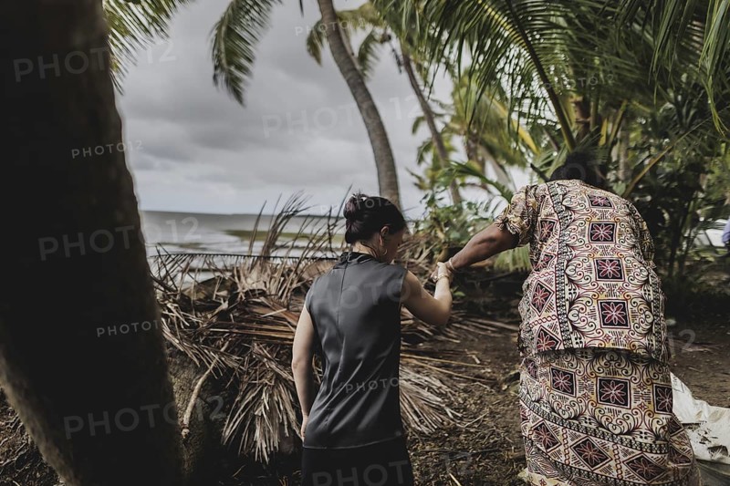 (L-R) Annalena Bärbock (Bündnis 90/Die Grünen), Federal Foreign Minister, and Lavenia McGoon, resident of the Togoru settlement, photographed during a briefing on coastal erosion at a cemetery near the Togoru settlement flooded by rising sea levels, 07.05.2024. Bärbock is travelling to Australia, New Zealand and Fiji for political talks / Photographed on behalf of the Federal Foreign Office