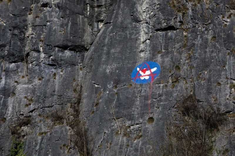 Steep rock face made of mass limestone with painting, Hönnetal, Balve, Sauerland, North Rhine-Westphalia, Germany, Europe