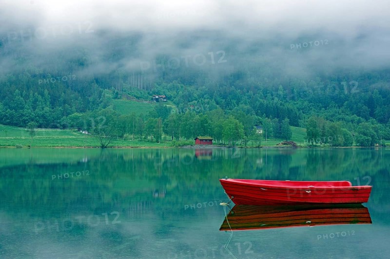 A small, red boat on a calm lake, idyll, surrounded by fog and green nature, Stryn, Mindesundet, Fjordland, Norway, Europe