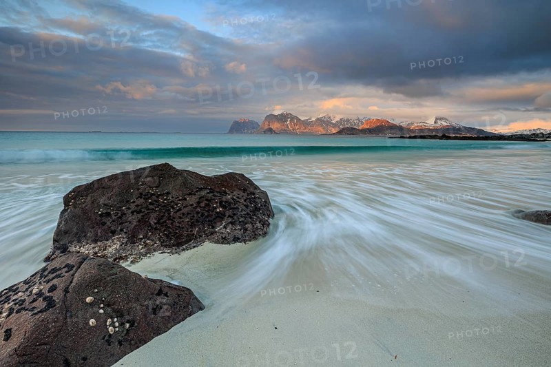 Rocks and beach in front of Bergen, sea, surf, spray, clouds, winter, Flakstadoya, Lofoten, Norway, Europe