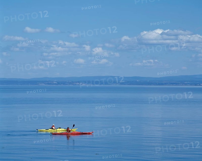 Sea Kayakers on Saint-Lawrence River in summer, Port-au-Persil, Charlevoix, Quebec, Canada, North America