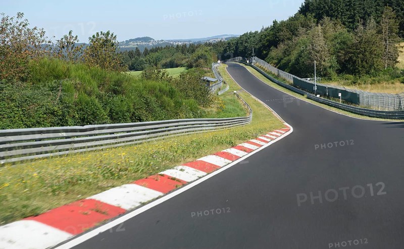 View from the perspective of racing drivers from the Schwedenkreuz approach to the international official race track for motorsport Nürburgring race track Nordschleife Green Hell Green Hell former historic Formula 1 track originally country roads in low mountain range Eifel, Nürburg, Rhineland-Palatinate, Germany, Europe