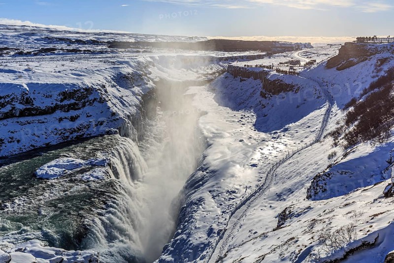 Large waterfall in a gorge in the snow, winter, sunny, backlight, spray, Gullfoss, Golden Circle, Southwest Iceland, Iceland, Europe