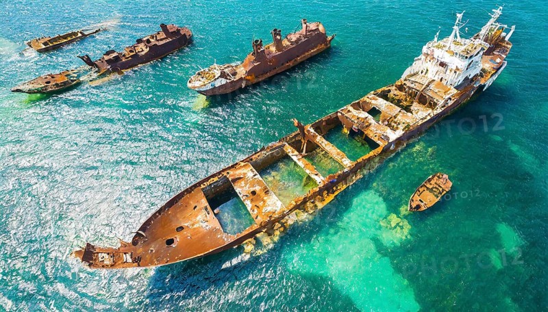 Abandoned, rusty shipwrecks in blue seawater showing destruction and decay, symbol photo, AI generated, AI generated