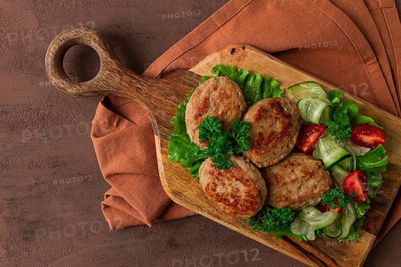 Fried cutlets, turkey, with vegetable salad, top view, no people