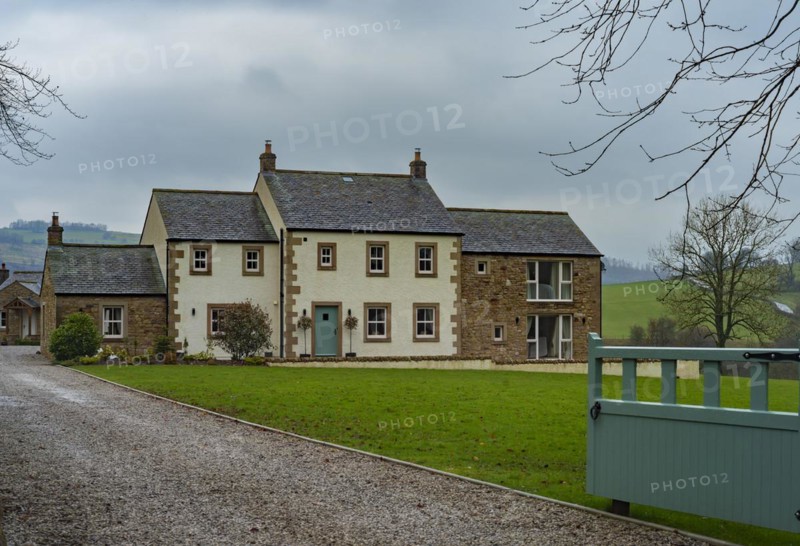 View of an older rendered house with a stone outbuilding behind a lawn and in front of a gravelled driveway with a gate, Typical landscape, Landscape photograph, Lake District, England, United Kingdom, Europe