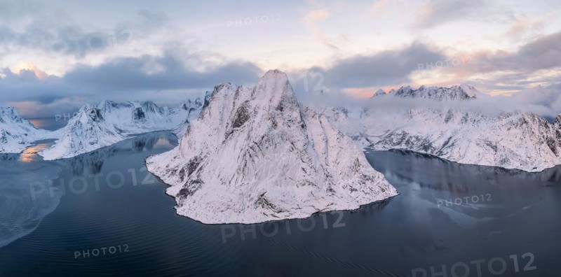 Snowy mountains by the fjord, Mount Olstinden, Reinefjord, Reine, Lofoten, Norway, Europe
