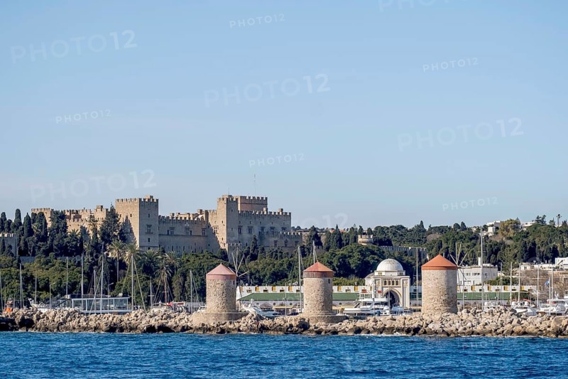 Exit from the harbour, view of the Grand Master's Palace and the three windmills, Rhodes, Dodecanese archipelago, Greek Islands, Greece, Europe
