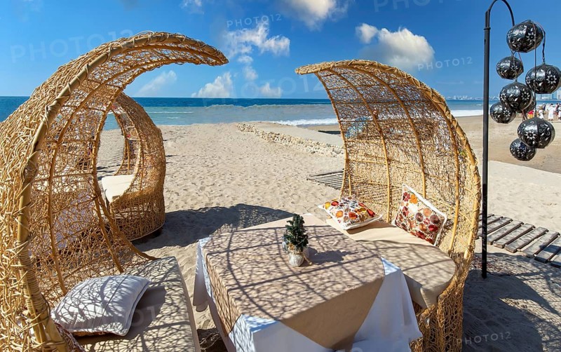Restaurants and cafes with ocean views on Playa De Los Muertos beach and pier close to famous Puerto Vallarta Malecon, the city largest public beach