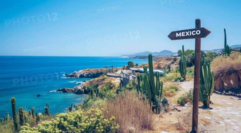 Sign pointing to the direction of Mexico with scenic beach and ocean in the background, AI generated