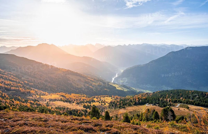 View of the mountain panorama and the Upper Inn Valley in the morning light, Krahberg on the Venet in autumn with yellow larches, Ötztal Alps, Tyrol, Austria, Europe