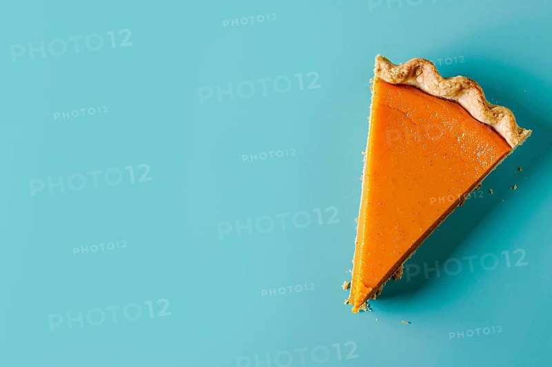 Top vie of single slice of pumpkin pie on blue background with copy space. Generative Ai, AI generated