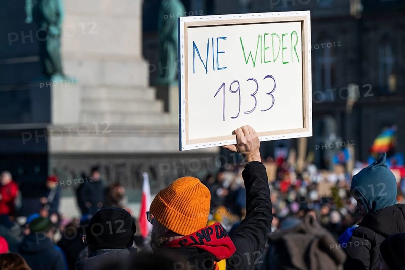 Pictures taken during the demonstration Haltung zeigen! against Nazi deportation plans of the AfD on the Schlossplatz in Stuttgart, 20.01.2024. A sign with the inscription Never again 1933
