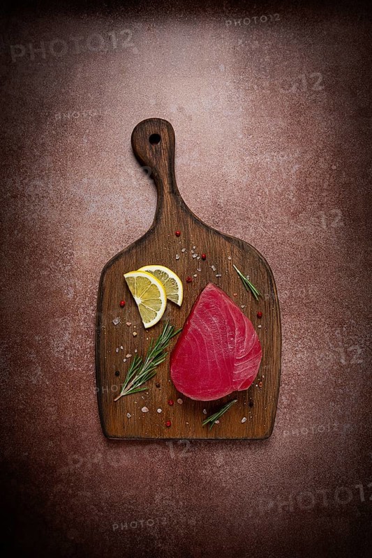 Fresh red tuna fillet, for steak, raw, top view, on a cutting board, no people