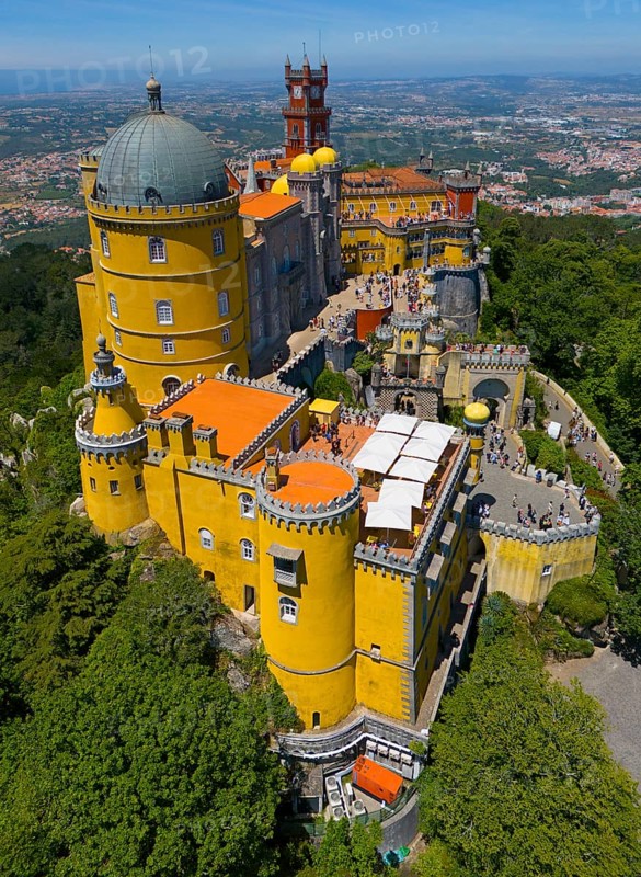 Historic castle in yellow on a hill with an impressive view and surrounded by forest, aerial view, Palácio Nacional da Pena, National Palace Pena, Sintra, Lisbon, World Heritage Site, UNESCO, Portugal, Europe