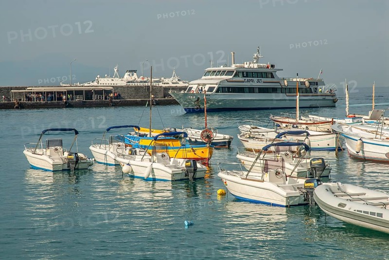 Leisure boats and incoming ferry boat in Marina Grande, Capri Island, Campania, Gulf of Naples, Italy, Mediterranean Sea, Europe
