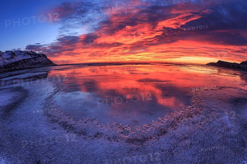 Dawn over an icy fjord, mountain landscape, fisheye shot, Breiddalsvik, East Fjords, Iceland, Europe