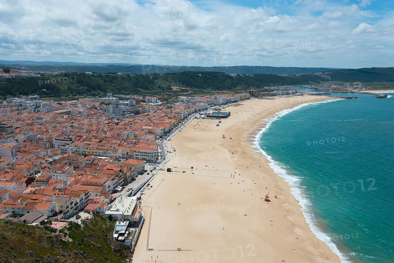 Beach with city in the background and extensive coastline, blue sea and soft clouds in the sky, view from Sítio to the lower town, Sitio, Nazaré, Nazare, Oeste, District Leiria, Centro, Estremadura, Portugal, Europe