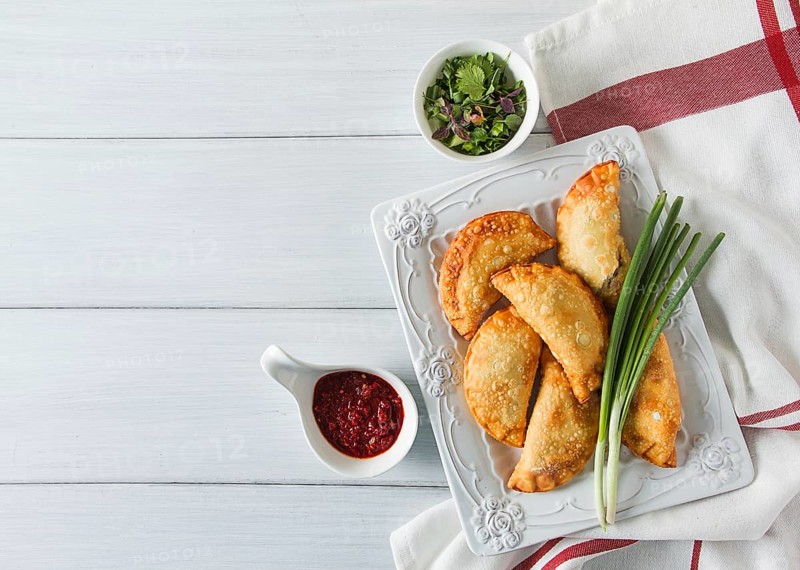 Fried chebureks, close-up, on a light background, no people