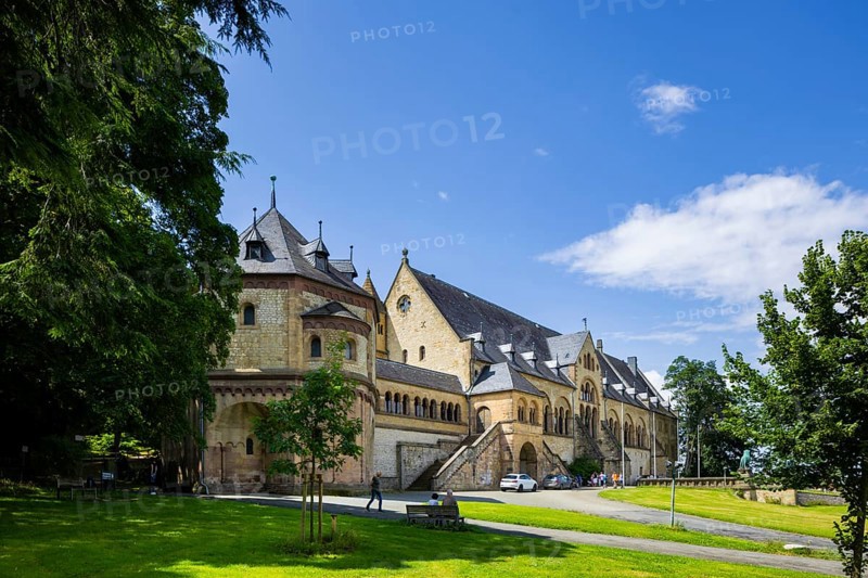 The imperial palace of Goslar covers an area of around 340 by 180 metres, situated at the foot of the Rammelsberg in the south of the town of Goslar, on which the imperial house, the former collegiate monastery St. Simon and Judas, the palace chapel of St. Ulrich and the Church of Our Lady are or were located. The imperial palace, built between 1040 and 1050 under Henry III, is a unique monument to secular architecture. For over 200 years, German and European history was written here at numerous imperial and court conventions. Copies of the Brunswick Lion and equestrian monuments in front of the imperial palace, Kaiserpfalz Goslar, Goslar, Lower Saxony, Germany, Europe