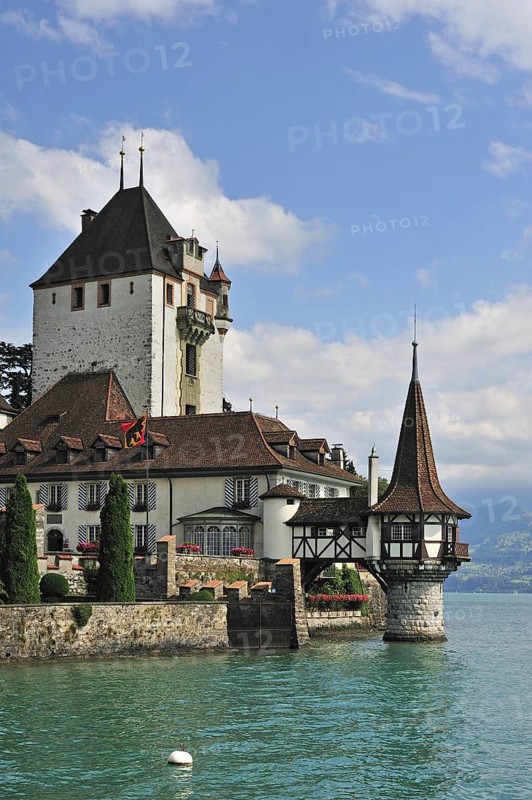 The water castle Schloss Oberhofen along the Tunersee, Lake Thun in the Bernese Alps, Switzerland, Europe