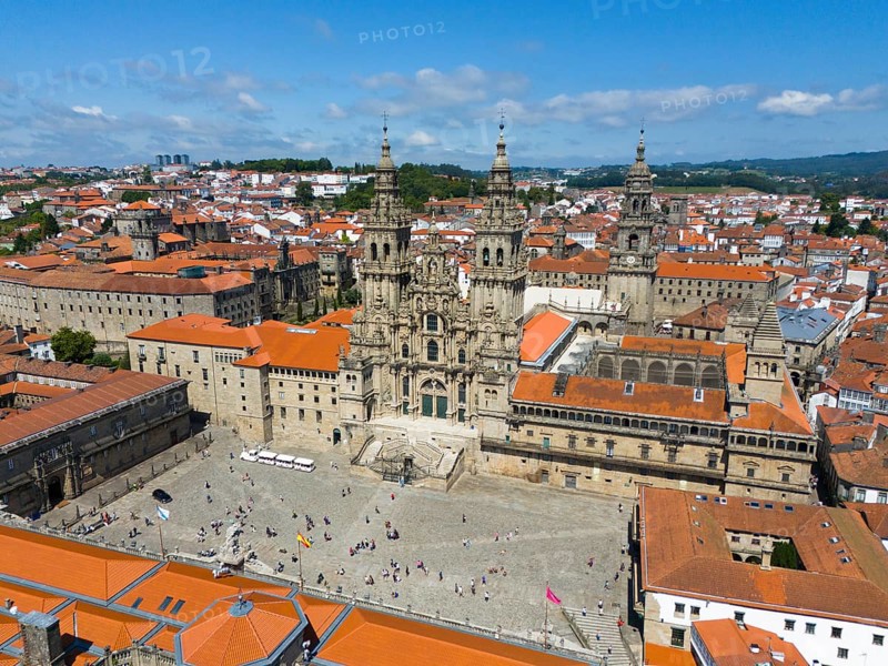 An aerial view of a cathedral and red roofs of a historic cityscape in sunny weather, Cathedral, Santiago de Compostela, autonomous community of Galicia, place of pilgrimage, destination of the Way of St James, Spain, Europe