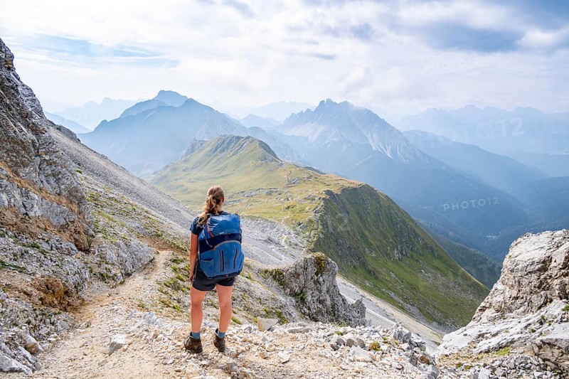 Hiker on the ascent to the Great Kinigat, Carnic Main Ridge, Carnic High Trail, Carnic Alps, Carinthia, Austria, Europe