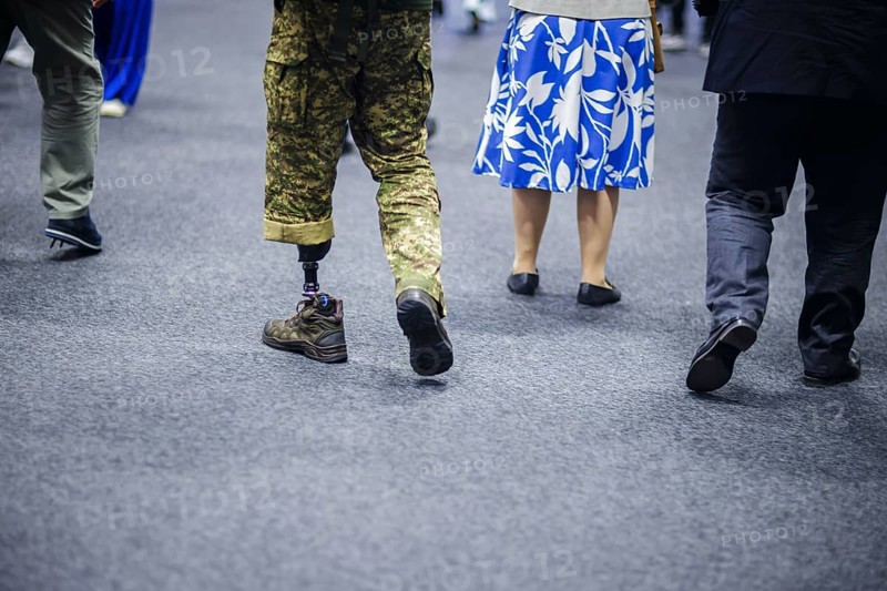 Ukraine Recovery Conference URC in Berlin. A Ukrainian soldier with a prosthesis walks through an exhibition hall. 'ÄôPhoto taken as Official Photographer'Äô