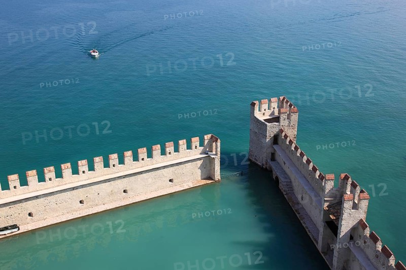 Harbour basin of the castle with flat Guelph battlements, Scaliger Castle, Castello Scaligero, in Sirmione, moated castle on the southern shore of Lake Garda, province of Brescia, Lombardy, Italy, Europe