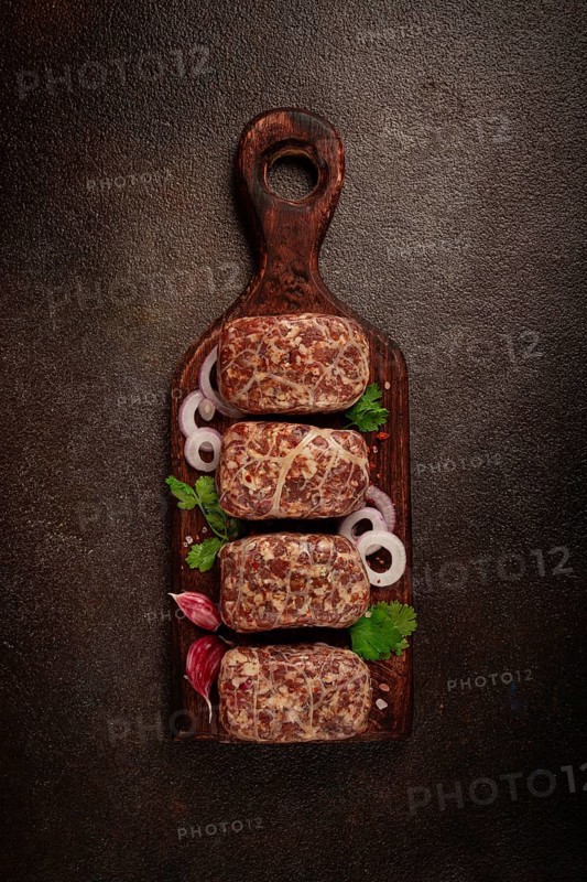 Raw apkhazura, a dish of Georgian cuisine, meat balls, minced meat wrapped in a fat net, seftalia, homemade, no people