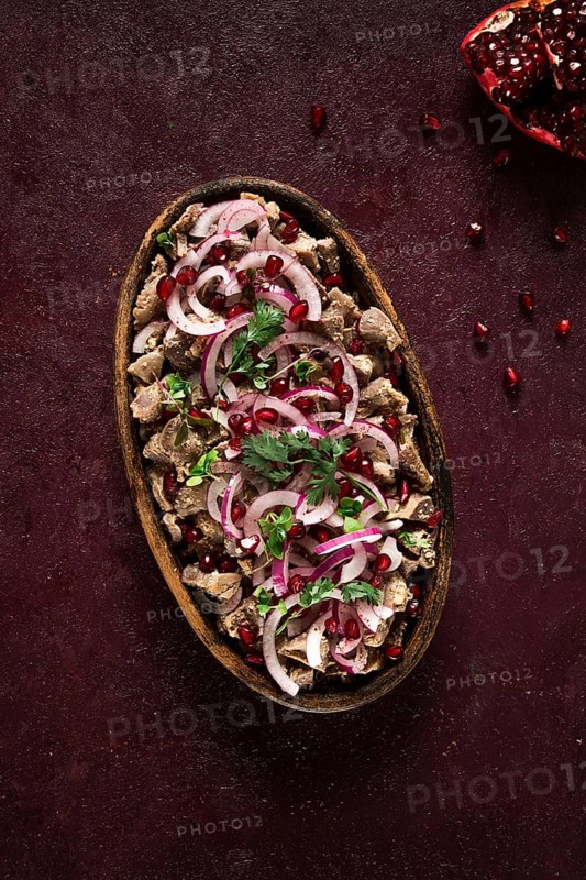 Kuchmachi, Traditional Georgian cuisine, chicken giblets appetizer, with spices and pomegranate seeds, on ketsi, no people, homemade