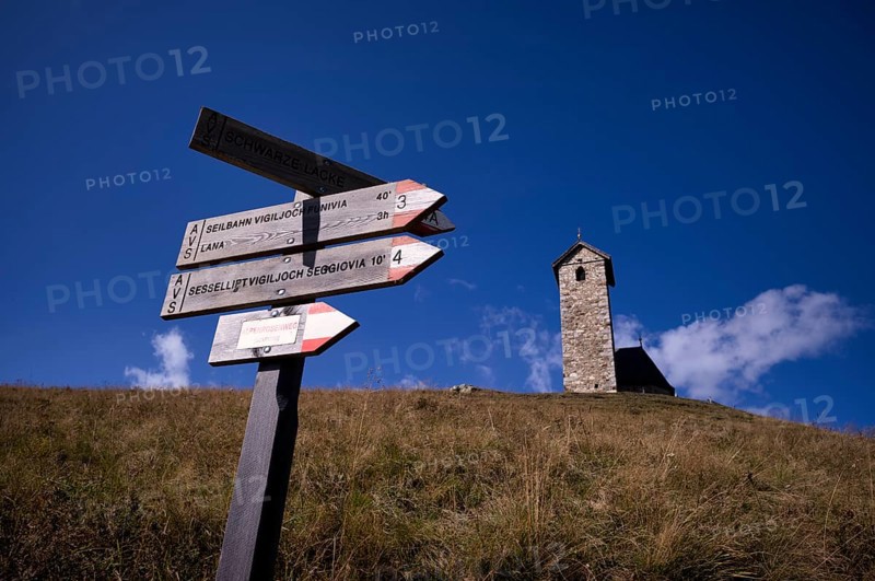 Signpost for hikers, Church of St. Vigil, Vigilius am Joch, Glaubensweg, near Lana, South Tyrol, Autonomous Province of Bolzano, Italy, Europe