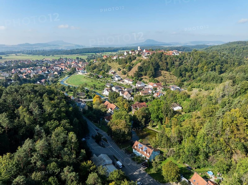 Aerial view of the town of Aach in Hegau, on the right the Aachtopf, Aachquelle, source of the Radolfzeller Aach, which flows into Lake Constance, on the horizon the Hegauberge, district of Constance, Baden-Württemberg, Germany, Europe