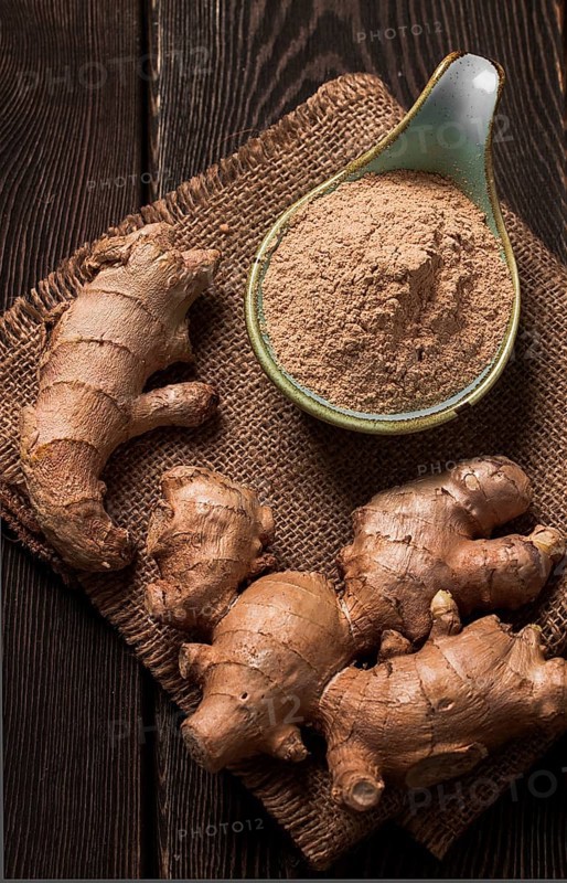Ground and fresh ginger root, on a wooden table, rustic style, selective focus, no people