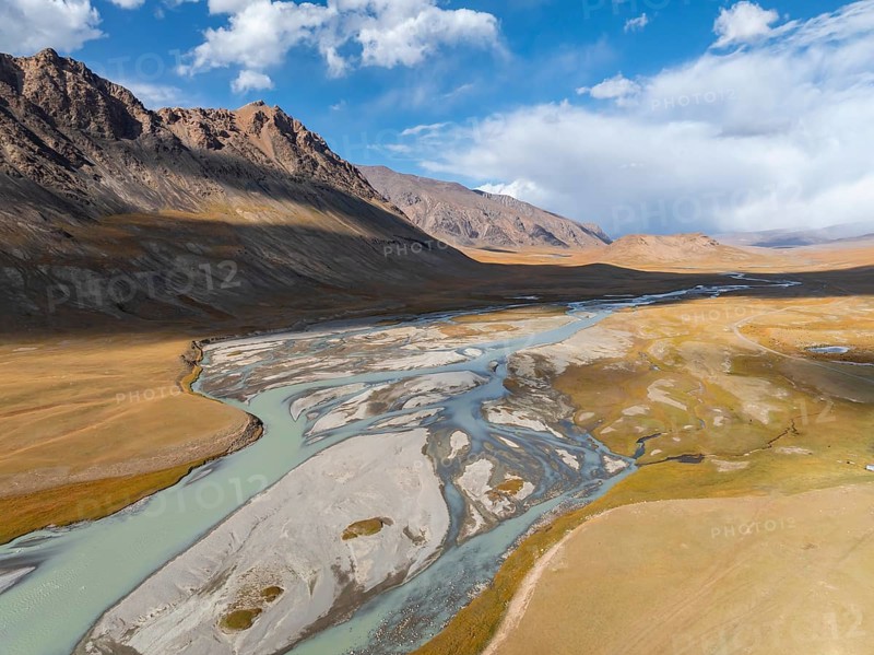 Aerial view, Burkhan mountain valley with meandering river, barren dramatic mountain landscape, Terskey Ala-Too, Tien Shan, Issyk Kul province, Kyrgyzstan, Asia