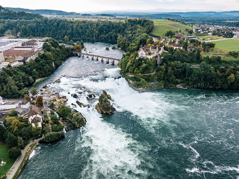 Aerial view of the Rhine Falls with railway viaduct and Laufen Castle in autumn, Neuhausen, Canton Schaffhausen, Switzerland, Europe