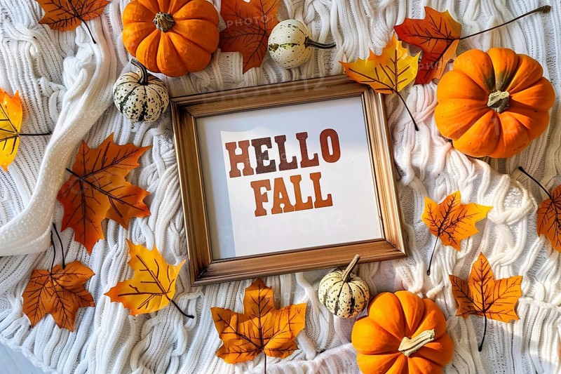 Top view of cozy autumn arrangement with picture frame with text 'Hell fall', pumpkins and colorful leaves. Generative Ai, AI generated